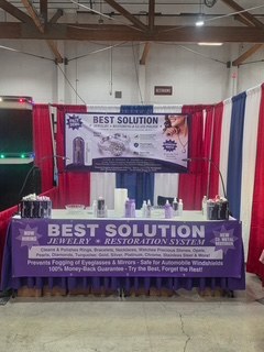 Best Solution jewelry restoration booth with red, white and blue drapes